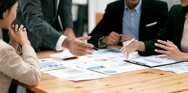 Business consulting team meeting with strategic documents